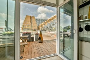 A hinged glass door operates with a glass panel instead of a solid core.